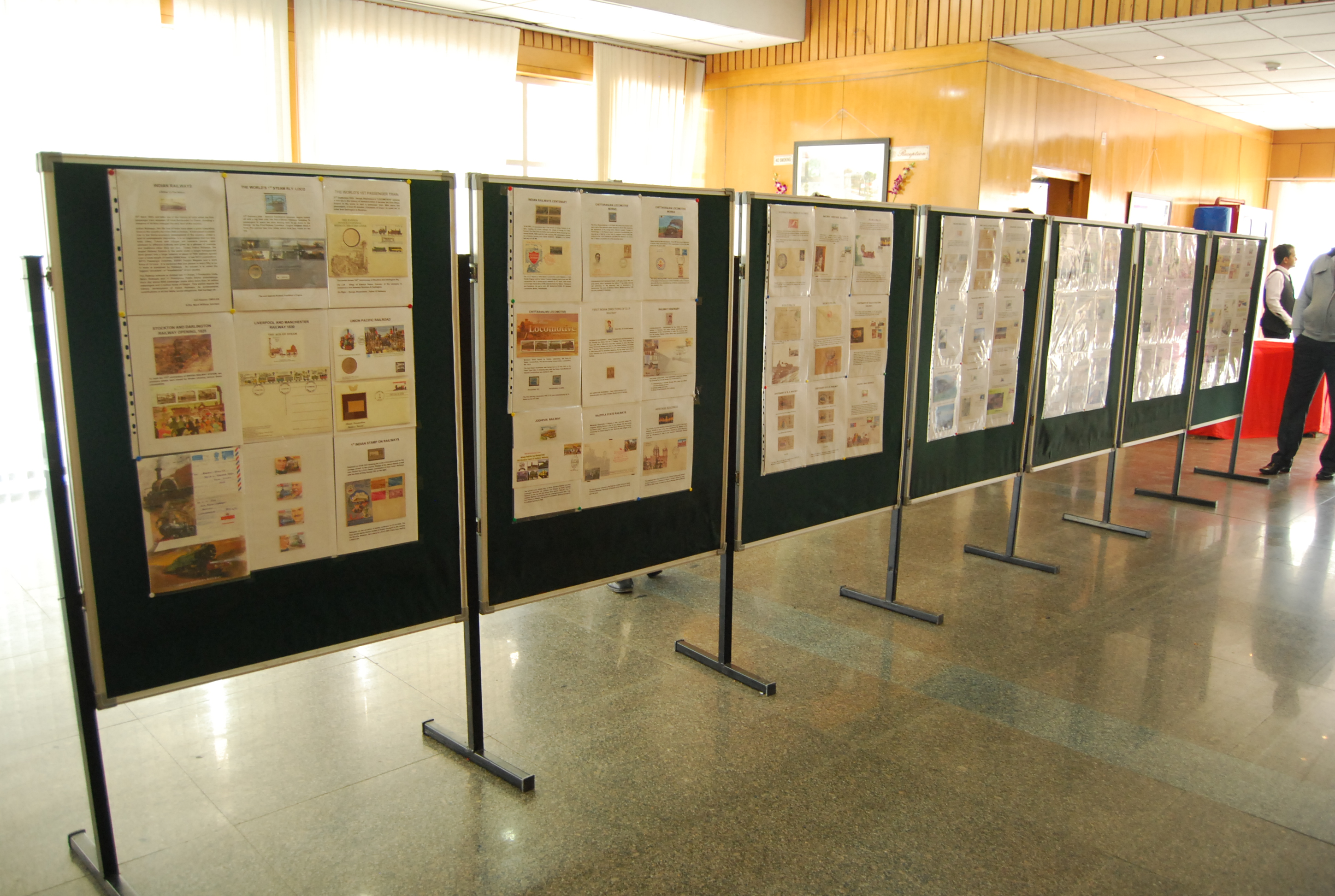 Exhibition stall design by Primar Partners showcasing modern branding and lighting